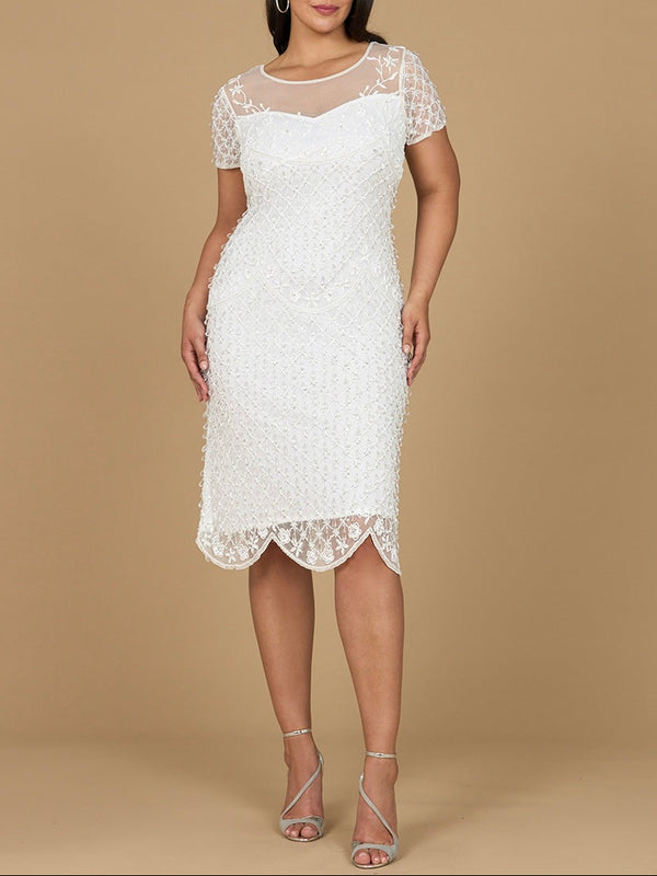 A model wearing a white beaded midi dress with cap sleeves and a sheer neckline.