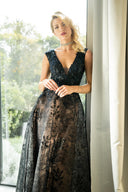 A green dress with long sleeves and ruffled detailing, showcasing a fashionable and unique style.