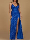 A green, beaded V-neck dress with spaghetti straps and a high slit on one side.