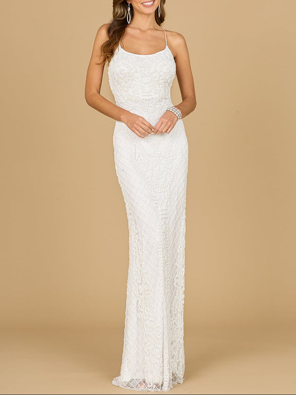 A woman in a white, scoop neck, open back beaded bridal gown with spaghetti straps and a fitted mermaid silhouette.