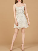 Woman wearing a white lace dress on a beige background