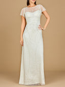 Woman wearing a long, white lace dress against a beige background