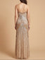Woman wearing a sparkly gold evening gown against a beige background